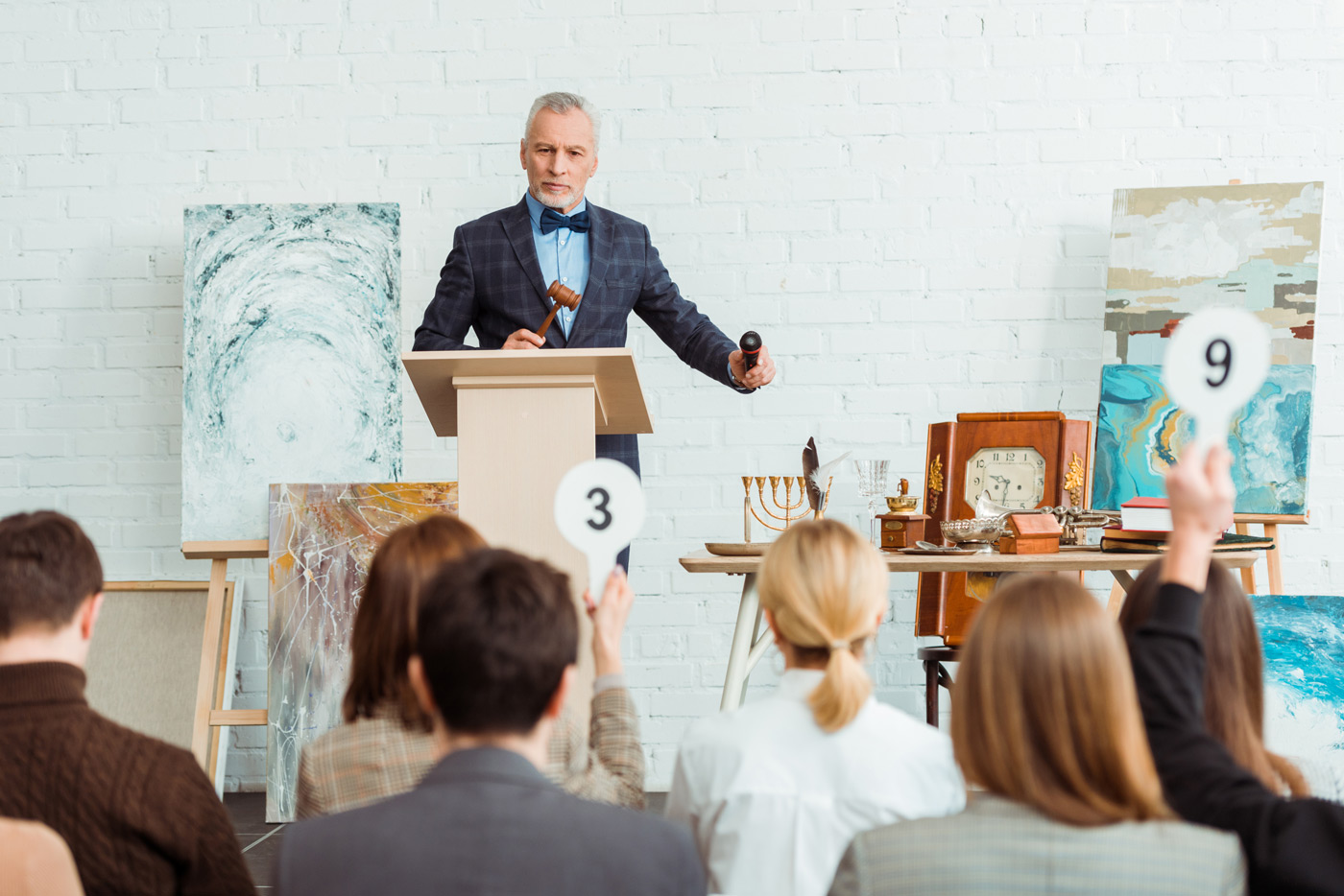 Auctioneer holding an auction legally with a surety bond