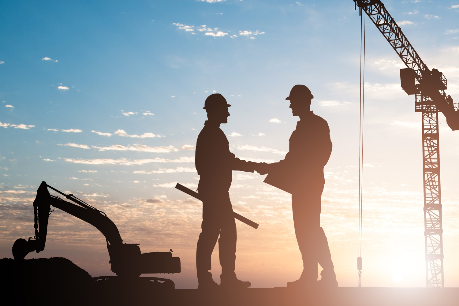 Contractor shaking hands with a supplier after signing a payment bond