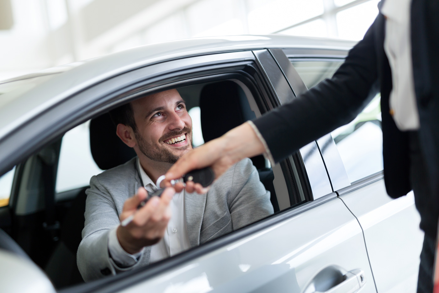 Man renting a car from a motor vehicle rental company