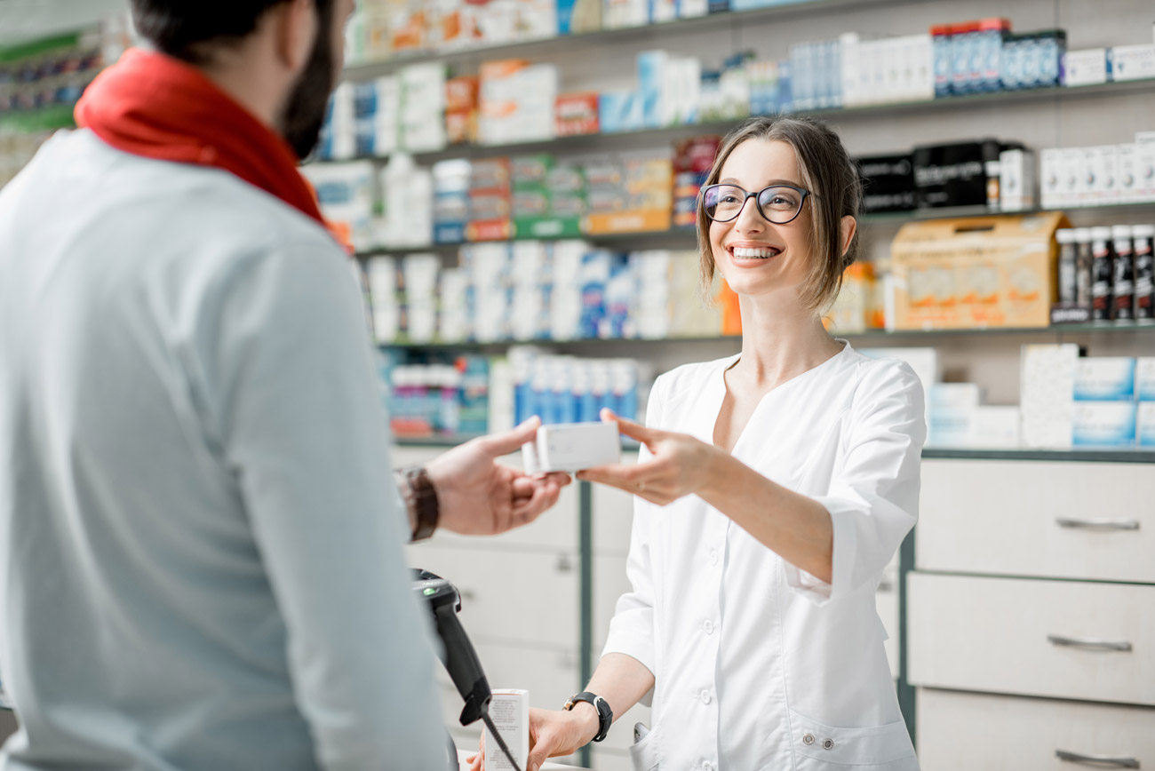 Bonded pharmacist helping a customer