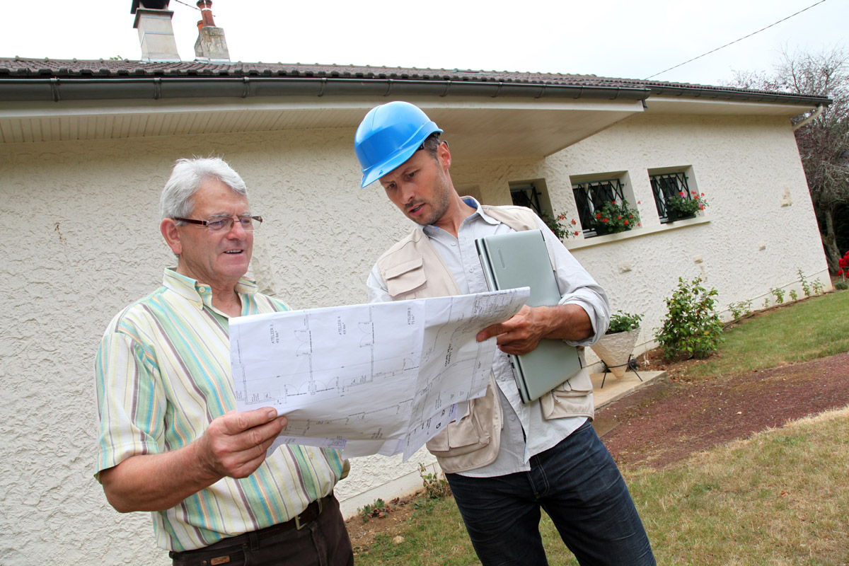 Bonded contractor talking with a client