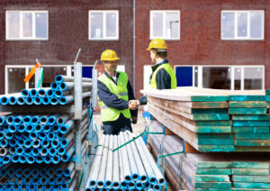 Bonded subcontractor shaking hands with a general contractor onsite