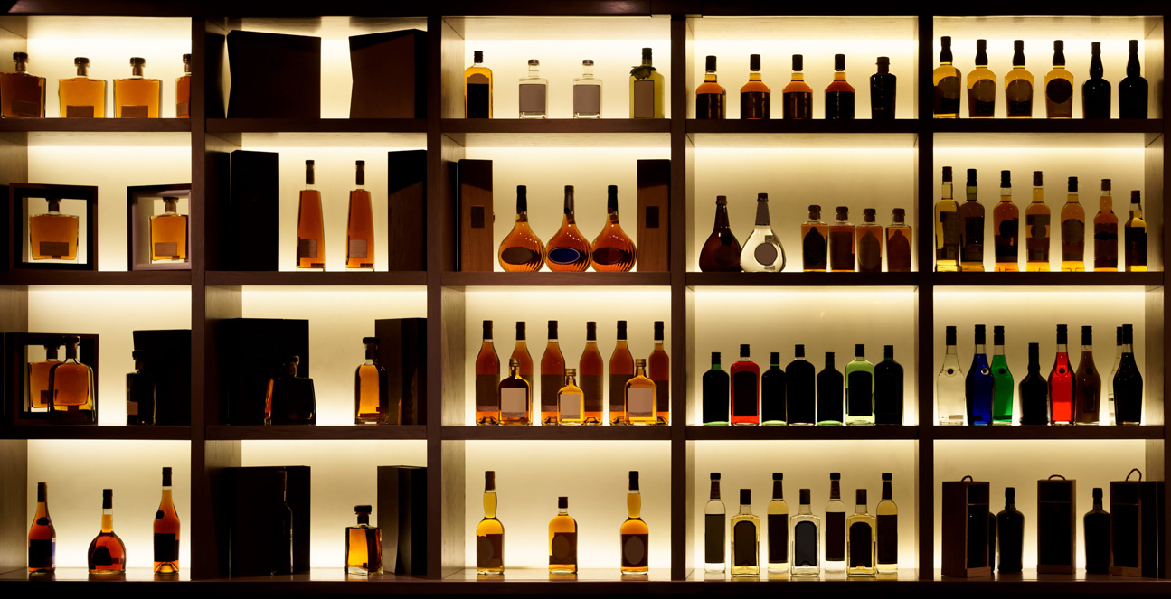 Shelf full of distilled spirits in a bar with a distilled spirits permit bond