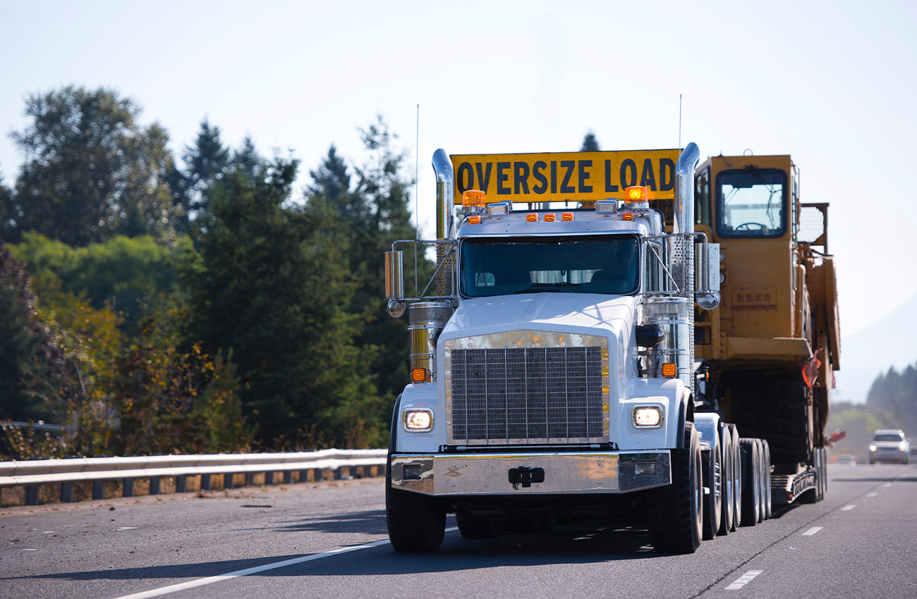 Oversize vehicle driving legally with permit bond and license