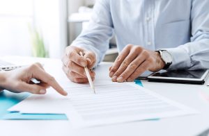 Signing a surety bond contract to become bonded