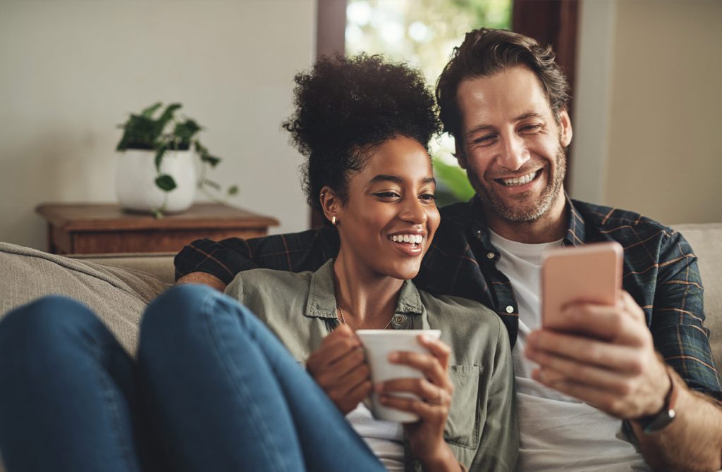 Couple celebrating for bad credit surety bond approval online