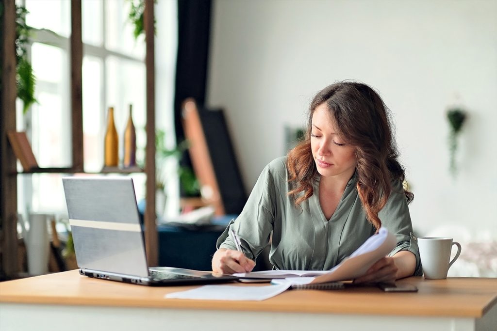 Notary public working at her desk at home