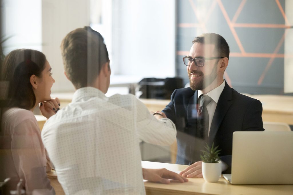 Male notary working with signers in person