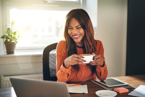 Female online notary working with coffee