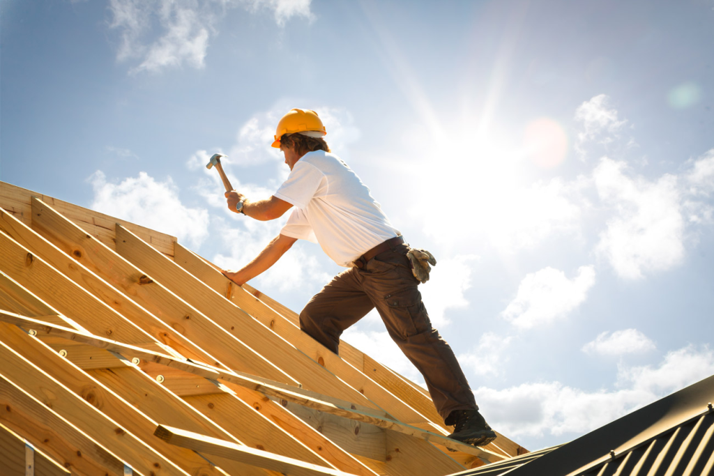 Bonded and licensed contractor at work on a roof